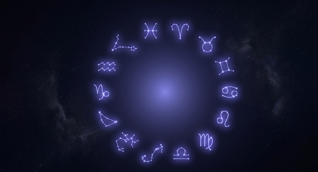 Los doce glifos del zodiaco dispuestos en círculo como constelaciones conectadas por líneas de luz