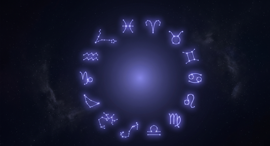 Los doce glifos del zodiaco dispuestos en círculo como constelaciones conectadas por líneas de luz